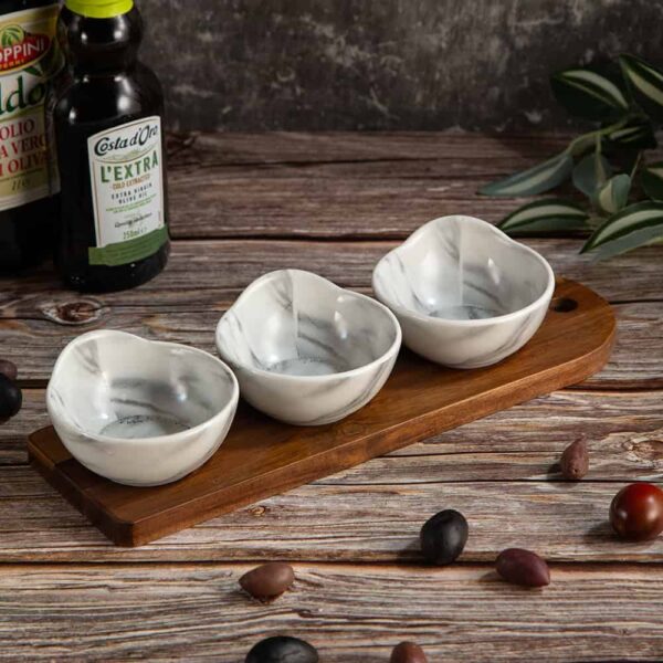 Set of round bowls on a bamboo stand from the Marble series