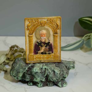 Decorative figurine of St. Nicholas the Wonderworker on a rock