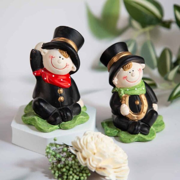 Decorative figurine of a chimney sweeper on a clover