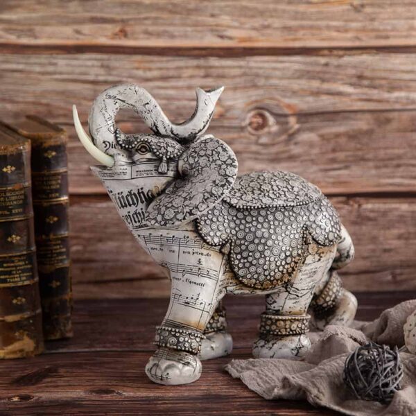 Elephant statuette with notes